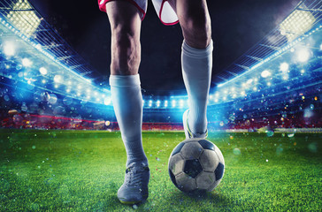 Soccer player ready to kick the soccerball at the stadium during the match