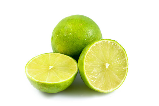 Juicy slice of lime, citrus fruit with green lemon half isolated on white background, Tropical fruit, Flat lay, top view.