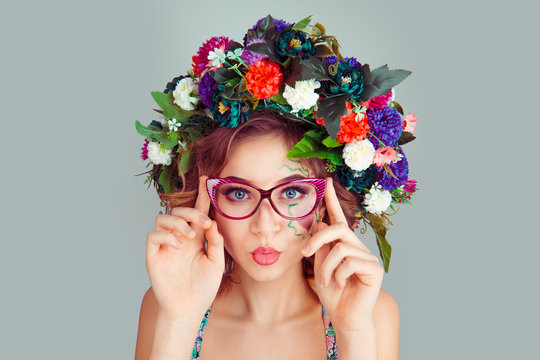 woman with dianthus flowers head floral headband blowing lips air kiss