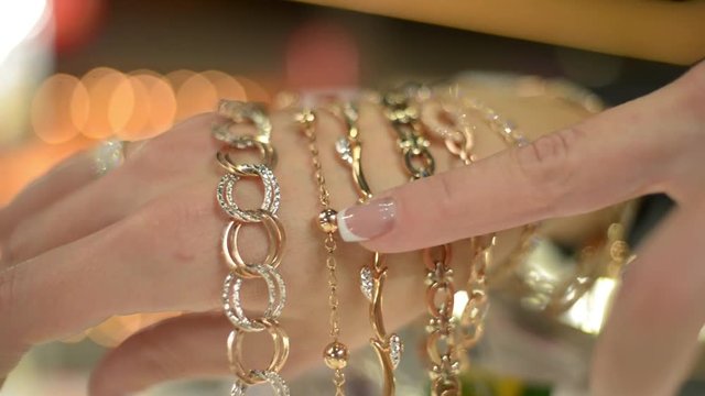 Jewels Market - the seller shows gold jewelry earrings, rings, bracelets, chain