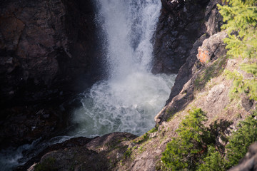The bottom of Booth Falls near Vail, Colorado flowing into a river. 