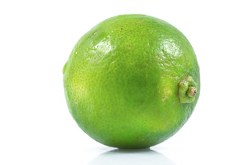Juicy slice of lime, citrus fruit with green lemon half isolated on white background, Tropical fruit, Flat lay, top view.