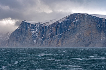 Fototapeta na wymiar Dramatic Cliffs Above Storm Tossed Seas