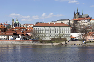 Obraz premium Spring Prague gothic Castle with the Lesser Town above River Vltava in the sunny Day, Czech Republic
