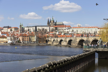 Spring Prague gothic Castle and Charles Bridge with the Lesser Town in the sunny Day, Czech Republic