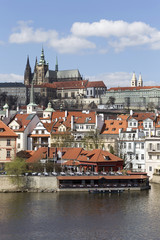 Obraz premium Spring Prague gothic Castle with the Lesser Town above River Vltava in the sunny Day, Czech Republic