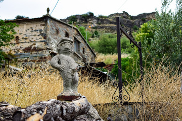 Figure of a garden in a rural village of a man in a pose of pissing on the street adorns the...