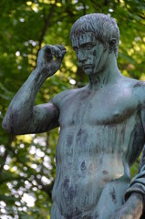 Fototapeta na wymiar bronze sculpture man athlete body