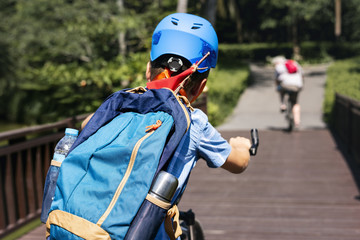 Boy riding a bike in the park