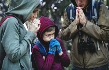 Family lost and cold in a forest