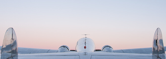Twin-prop plane at sunset