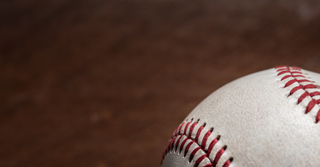 A group of vintage baseball equipment, bats, gloves, baseballs on wooden background