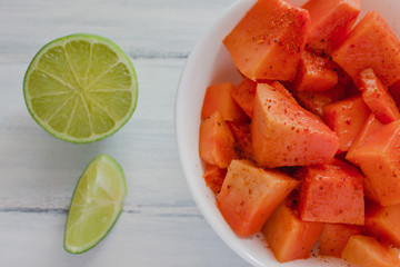 papaya fruit with chili, mexican snack, spicy food mexico
