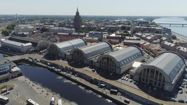 Central market in Riga city historical Europe town living houses and building with roads and cars traffic Drone flight