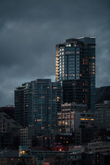 Tall Buildings In Seattle During A Cloudy Sunset