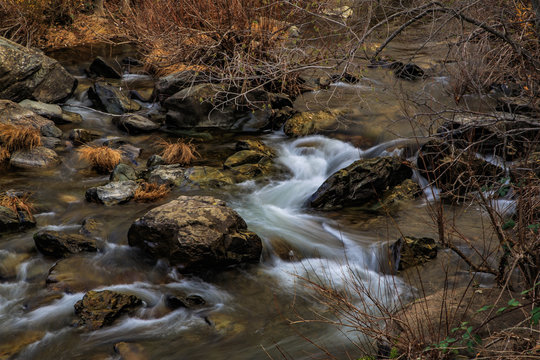 Slow motion water stream with rocks © James Sakaguchi