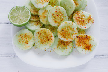pepinos, Slicepepinos con chile, Slices of cucumbers and chili, mexican snack, spicy food in mexicos of cucumbers