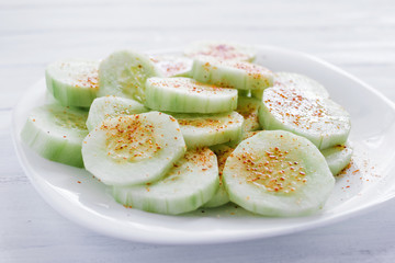 pepinos con chile, Slices of cucumbers and chili, mexican snack, spicy food in mexico