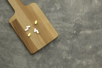  drug on Chopping board and Concrete old gray Texture of floor for background