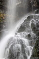 Fototapeta na wymiar Boyana Waterfall long exposure water flowing down the rocks, Vitosha Mountain, Sofia Bulgaria