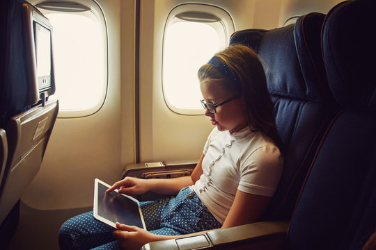 girl on board an airplane