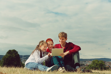 Fototapeta na wymiar family using a tablet computer