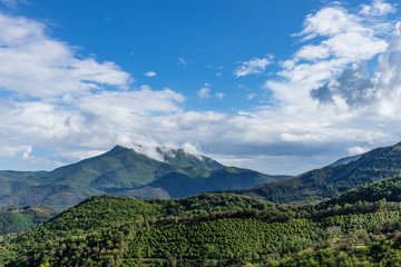 Fototapeta premium Mountain landscape on a blue sky with some clouds