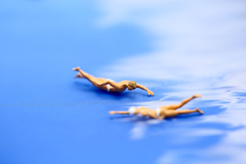 Miniature people: Vacationers are enjoy to swimming.