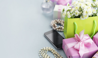 Banner Decorative composition boxes with gifts flowers women's jewelry shopping holiday grey background.