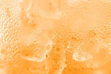 water drop soda ice baking background fresh cool ice orange texture, selective focus