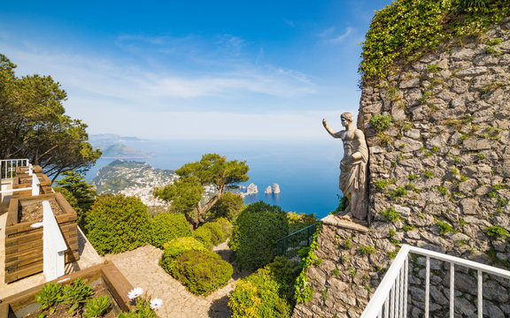 Faraglioni Rocks and statue of Emperor Augustus at Mount Solaro in Capri, Italy