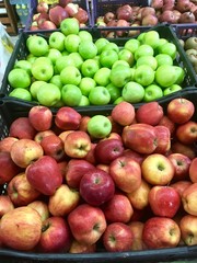 Fresh apples on the shelves of the market