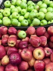 Fresh apples on the shelves of the market