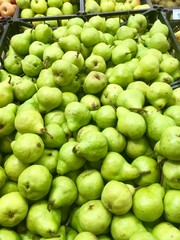 Fresh pears on the shelves of the market
