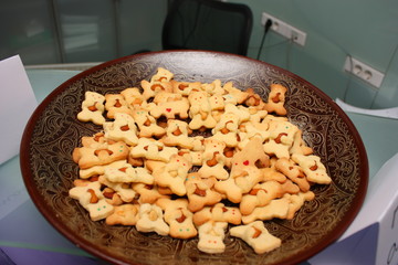 Teddy bear cookies with almonds on a plate