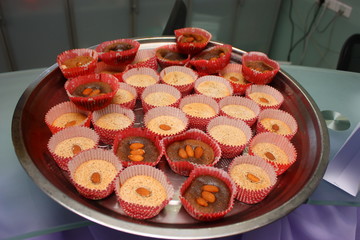 Cupcakes with almonds on a plate