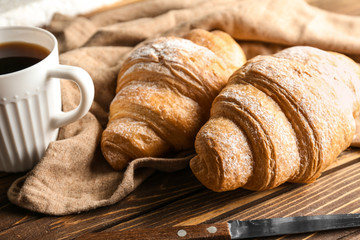 Tasty croissants on table, closeup