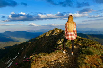 Woman hiker on a top of a mountain - 210272752