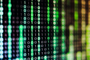 power of big data. binary code information bit on computer monitor screen display. green light text...