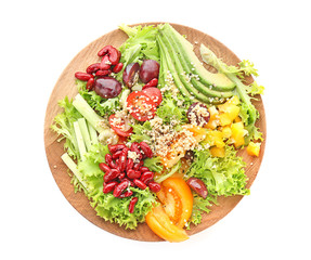 Plate with quinoa salad on white background, top view