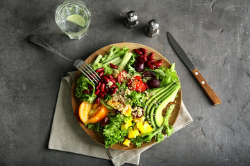 Composition with quinoa salad on grey background