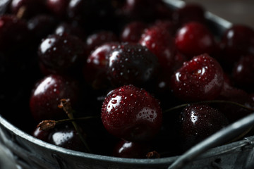 Metal basket with ripe cherry, closeup