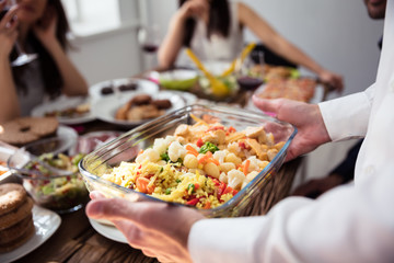 Waiter Holding Bowl Of Food