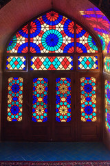 Fototapeta na wymiar Stained glass window of Nasir Ol-Molk mosque, also famous as Pink Mosque. Shiraz. Iran