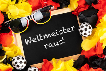 blackboard with german text weltmeister raus, in english world champion out