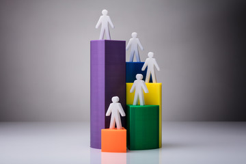 Human Figures Standing On 3D Pie Chart