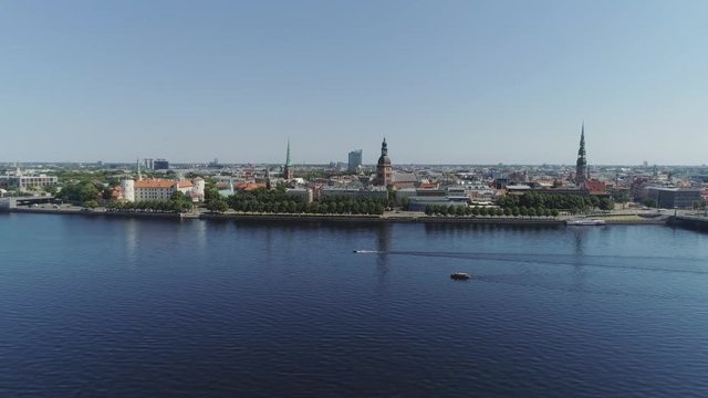 Old Riga City Slowmotion drone Flight Old town air flight with buildings and cars near daugava river and Library