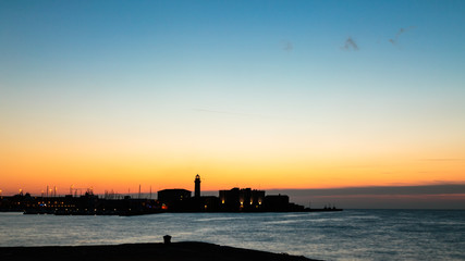 Colorful sunset in front of the city of Trieste