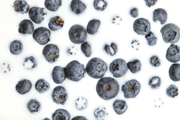 Top view of blueberries in milk.