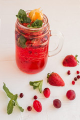 Refreshing drink with cranberries and strawberries	